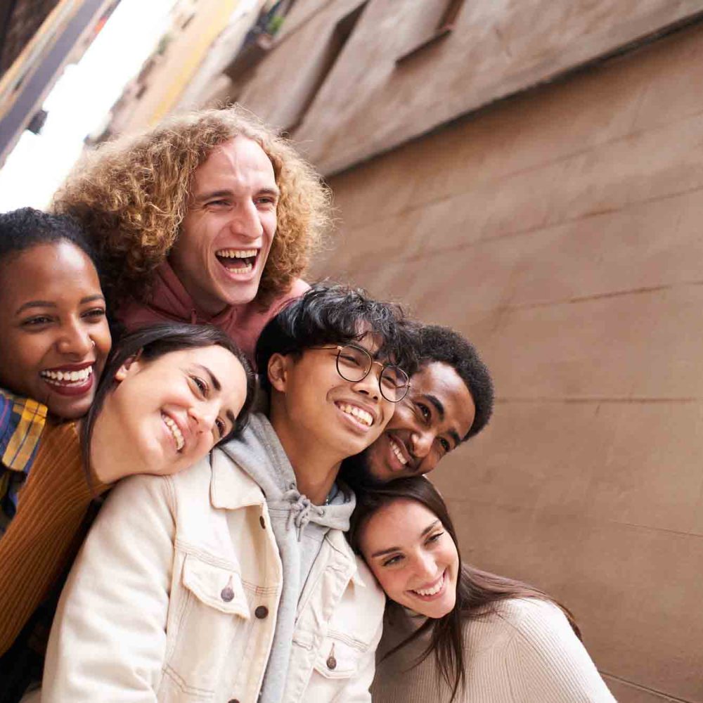 Group of funny people taking smiling selfie outdoors in the. street. Happy friends having fun. High quality photo